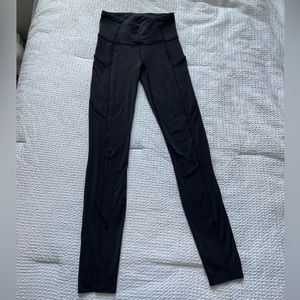 Lululemon fast and free leggings with pockets. Black, raw hem, size 2